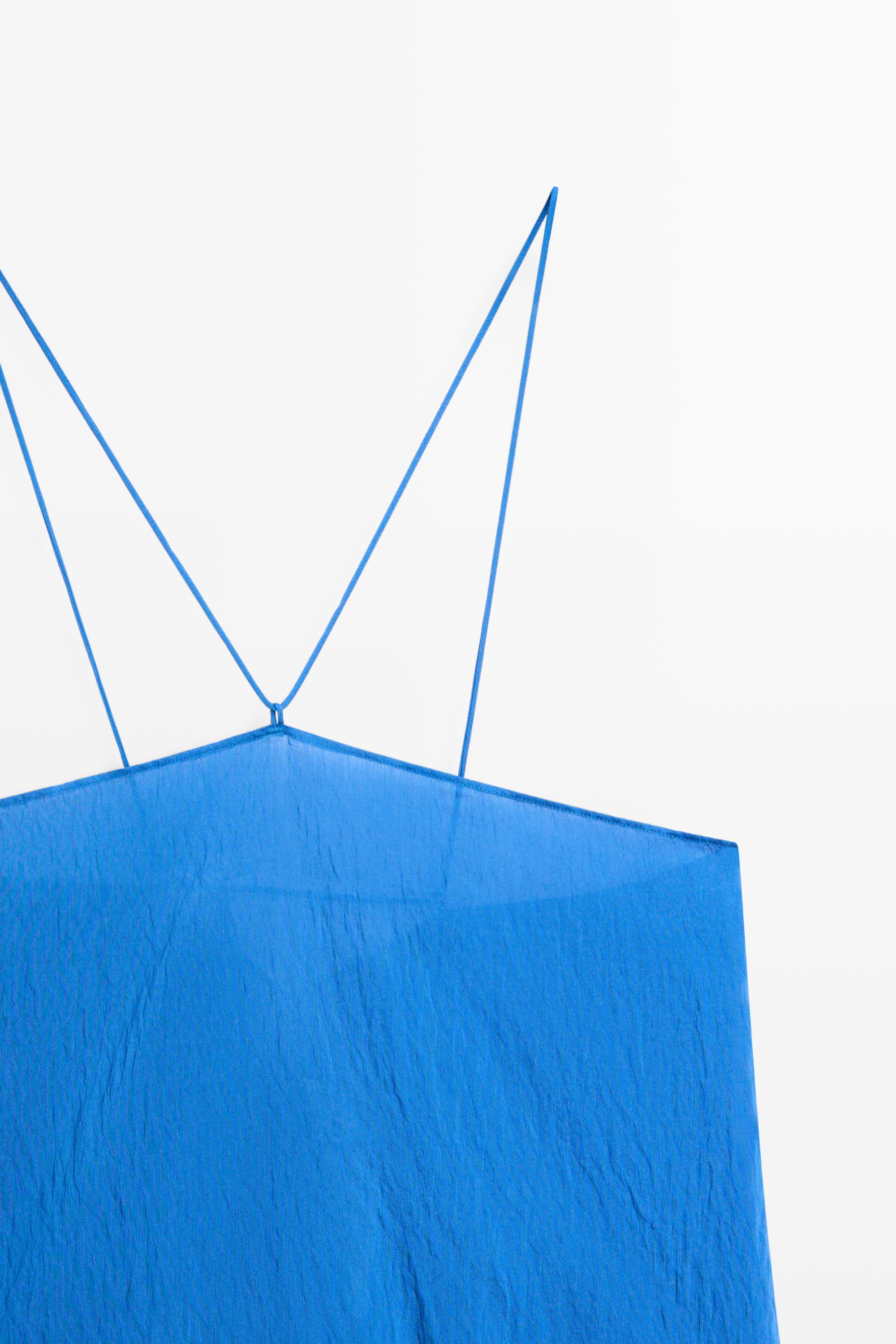 Flowing halter top with tie detail
